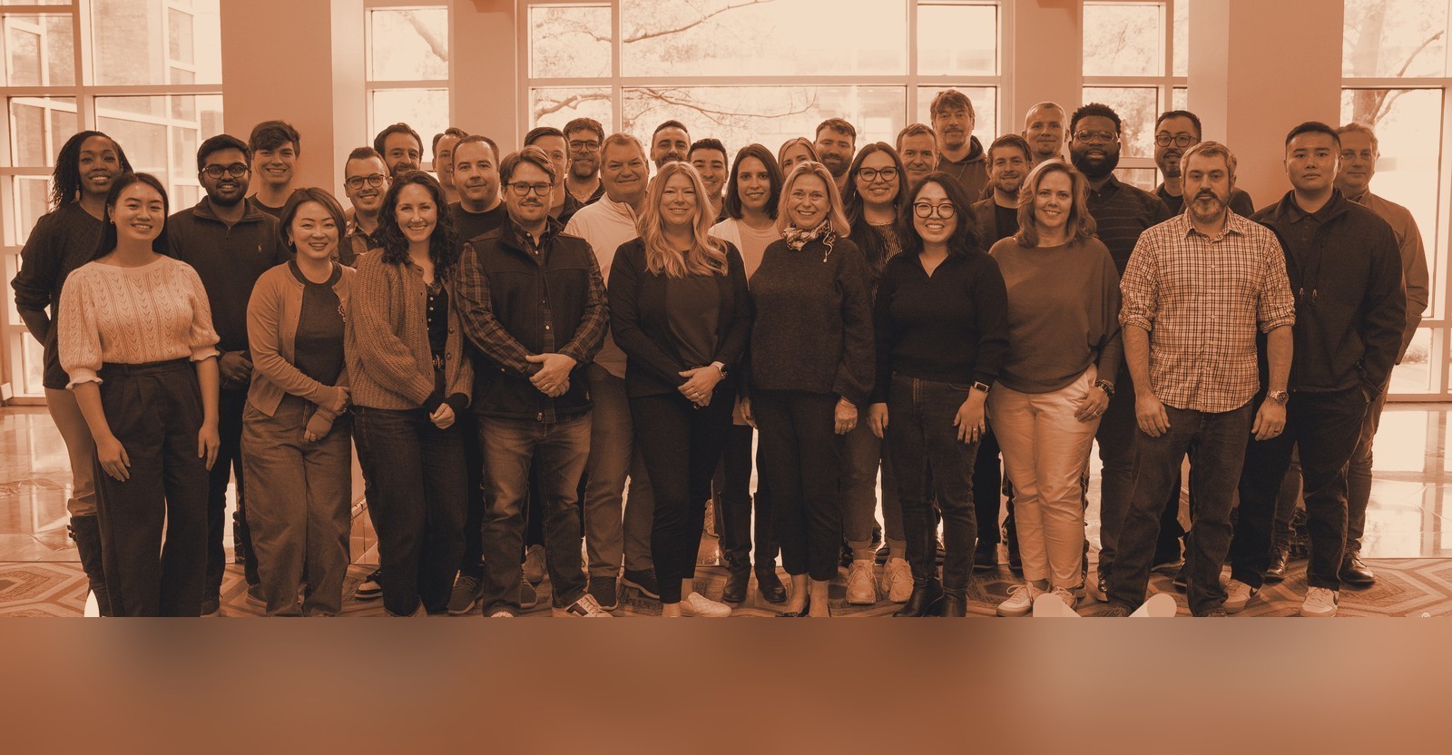 The cross-functional team and client partners behind the engagement (branding redacted)